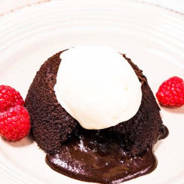 keto lava cake recipe on a plate with raspberries