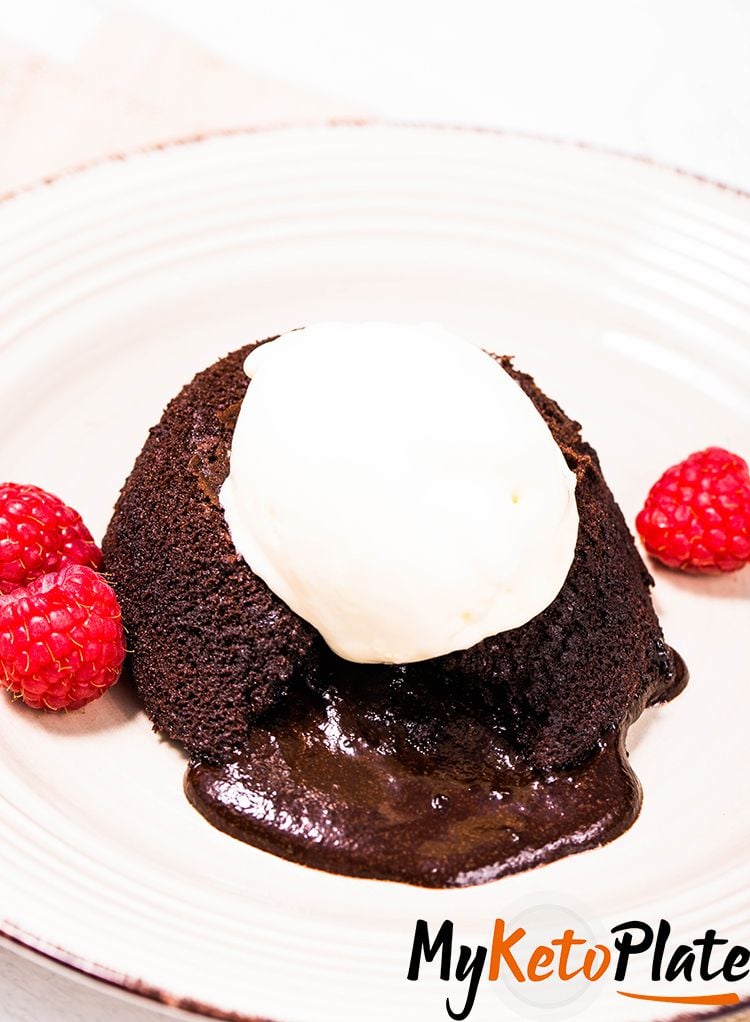 keto lava cake recipe on a plate with raspberries