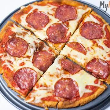 A homemade Fathead dough pizza with a low-carb crust, gooey cheese, and crispy pepperoni slices.