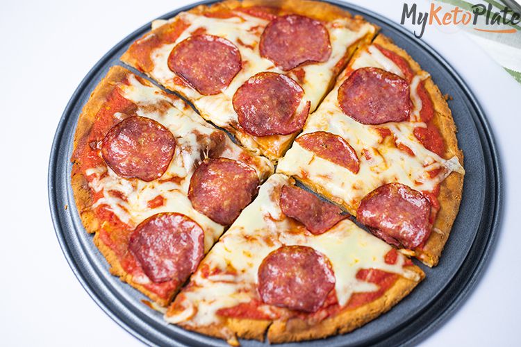 This keto pizza with fathead dough is super easy to make at home. The dough needs only four ingredients, and it tastes just like the real thing. It’s crispy, chewy and delicious. Add all your favorite toppings, and you will enjoy a slice of heavenly delicious pizza with just three net carbs.