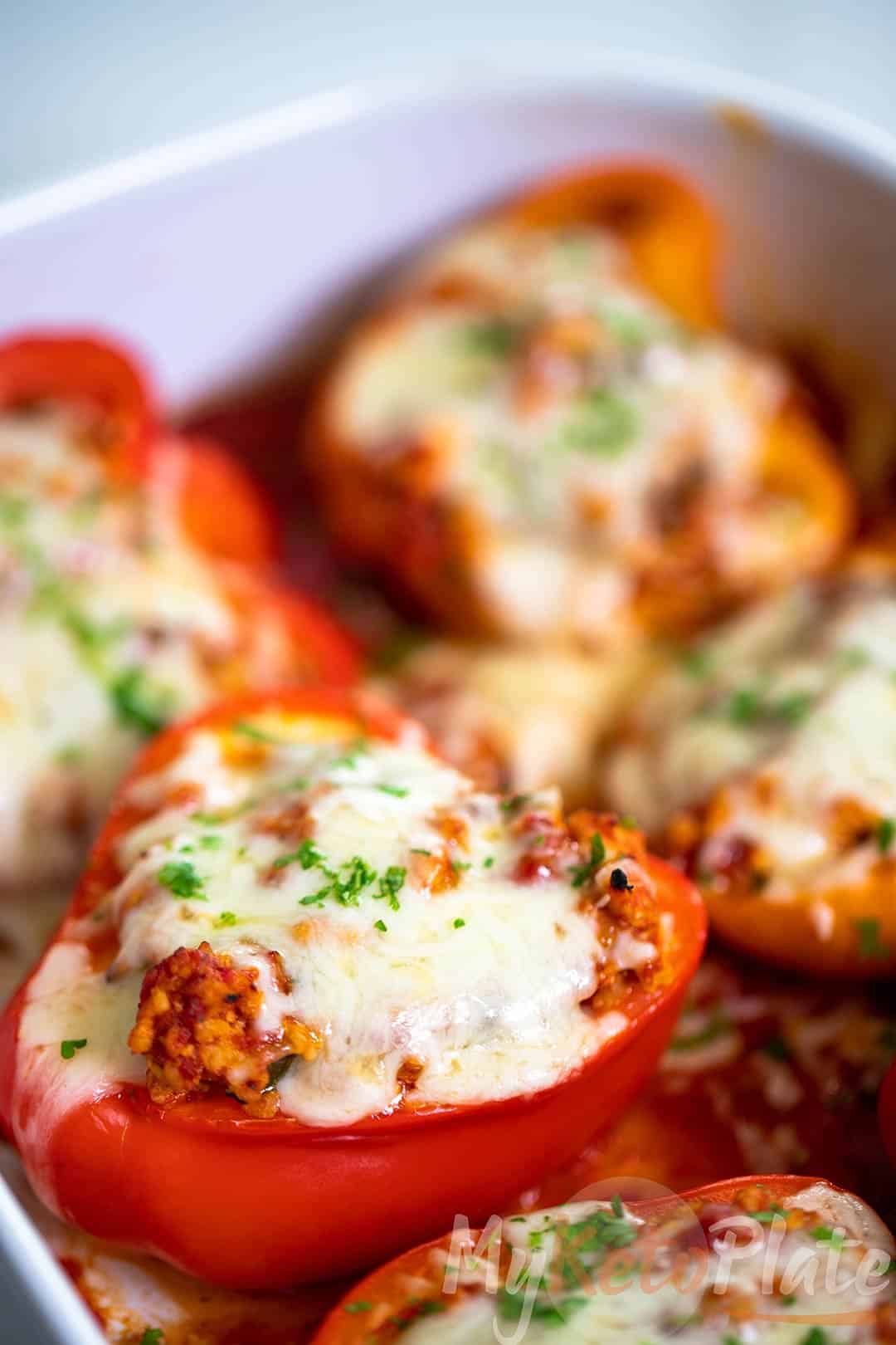 Ground turkey stuffed peppers covered in melted mozzarella cheese, fresh from the oven.