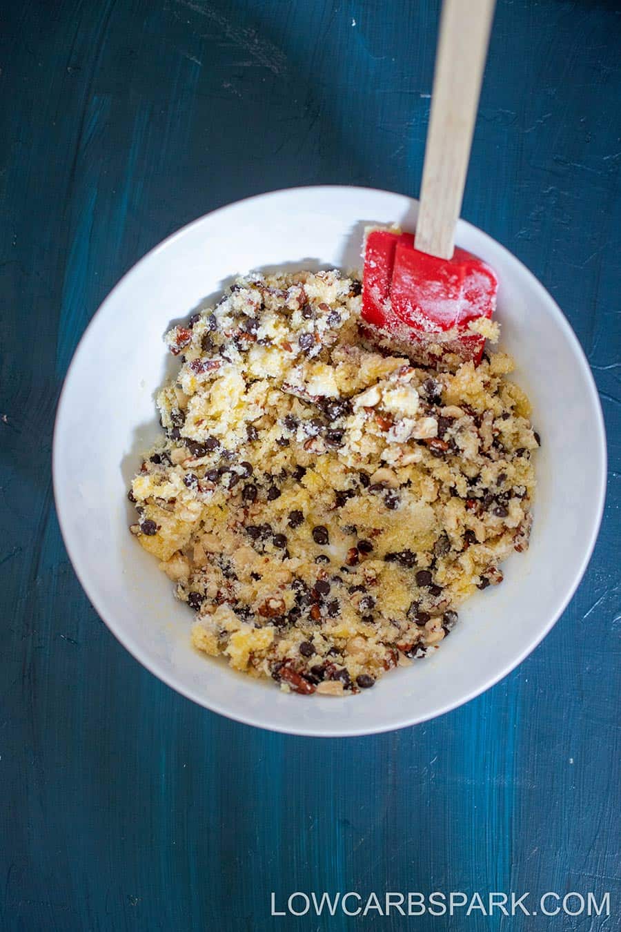 A thick, crumbly keto cookie mixture ready to be shaped into cookies.
