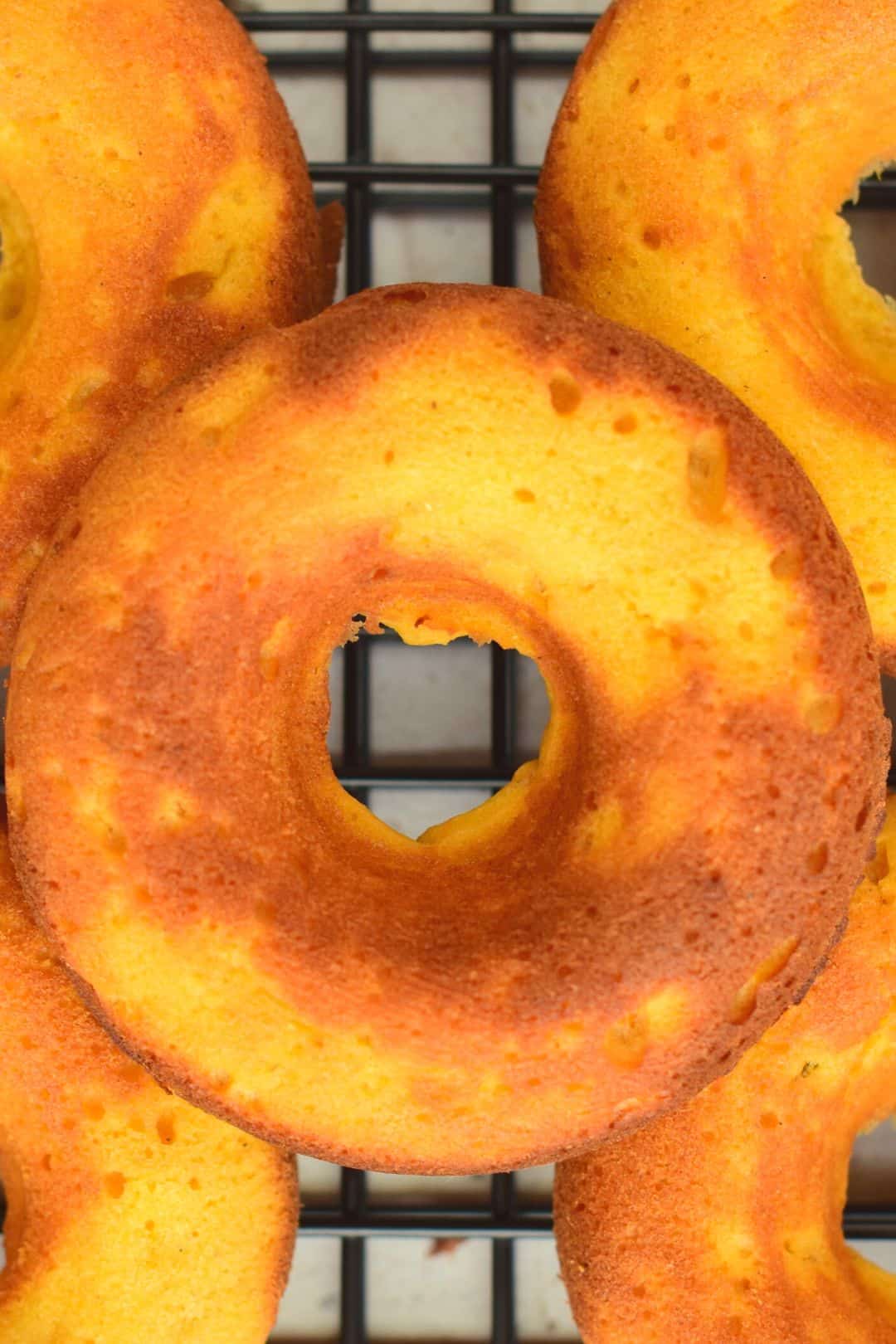 Fluffy and slightly crispy keto donuts with a perfectly round shape.
