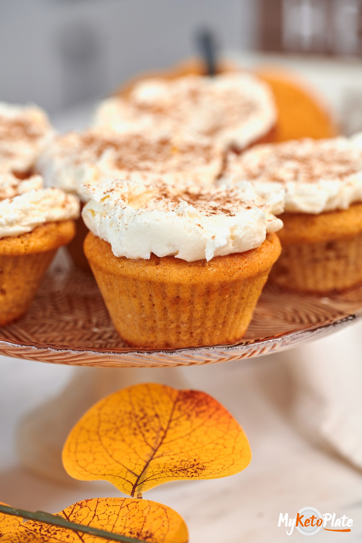 High-Protein Cottage Cheese Pumpkin Muffins 4 1. High-Protein Cottage Cheese Pumpkin Muffins topped with cinnamon cream cheese frosting and arranged on a serving plate for fall.